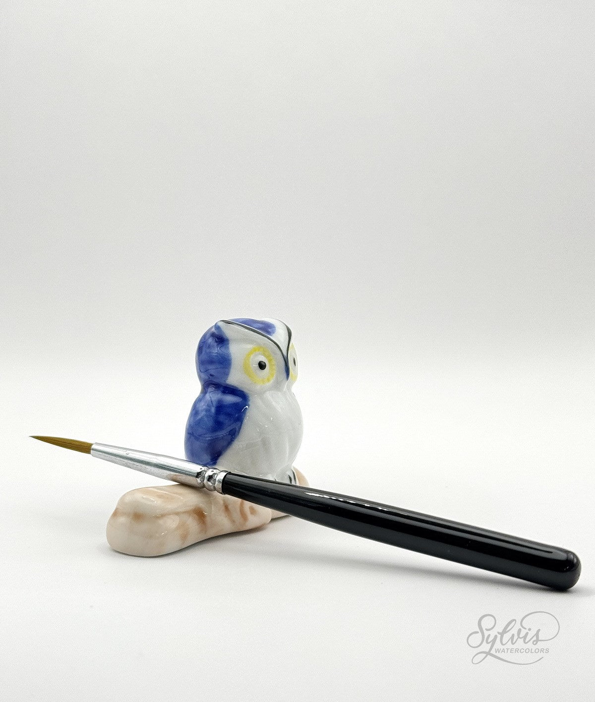 Pinselablage blaue Eule von vorn mit aufliegendem Pinsel